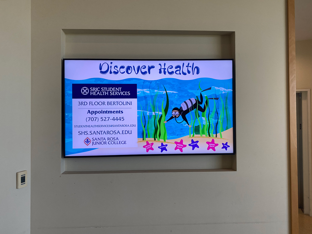 Colorful illustrated flyer for SRJC Student Health Services featuring an underwater theme with seaweed, a scuba diver, and starfish. Text reads 'Discover Health.' Lists location as 3rd Floor Bertolini and provides contact information for appointments at (707) 527-4445, email studenthealthservices@santarosa.edu, and website shs.santarosa.edu. Starfish highlight services including physical health, resources, mental health, referrals, sexual health, and more. Includes Santa Rosa Junior College logo.